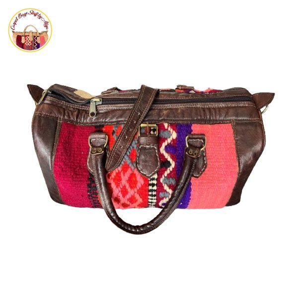 Vibrant carpet bag with colorful floral patterns on a neutral background.